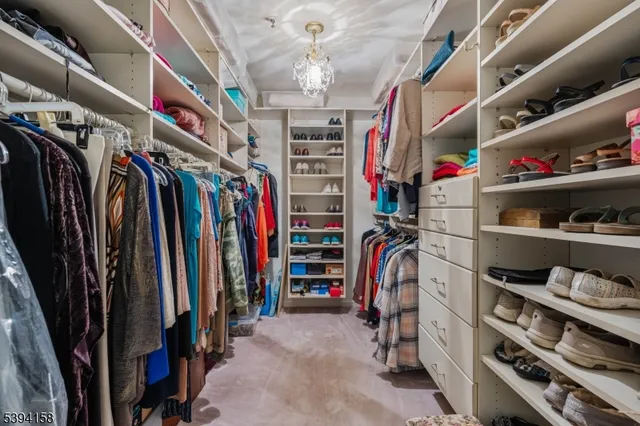 a view of a house with brick walls and a yard with plants