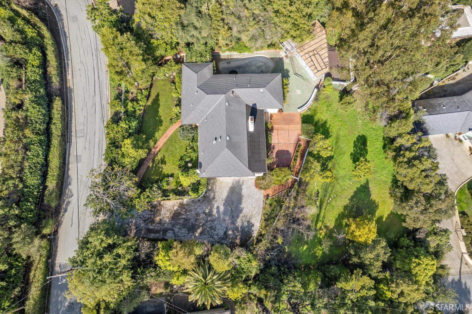 2480 Summit Drive Hillsborough, CA 94010 - Photo 5 of 12 an aerial view of a house with a yard and garden