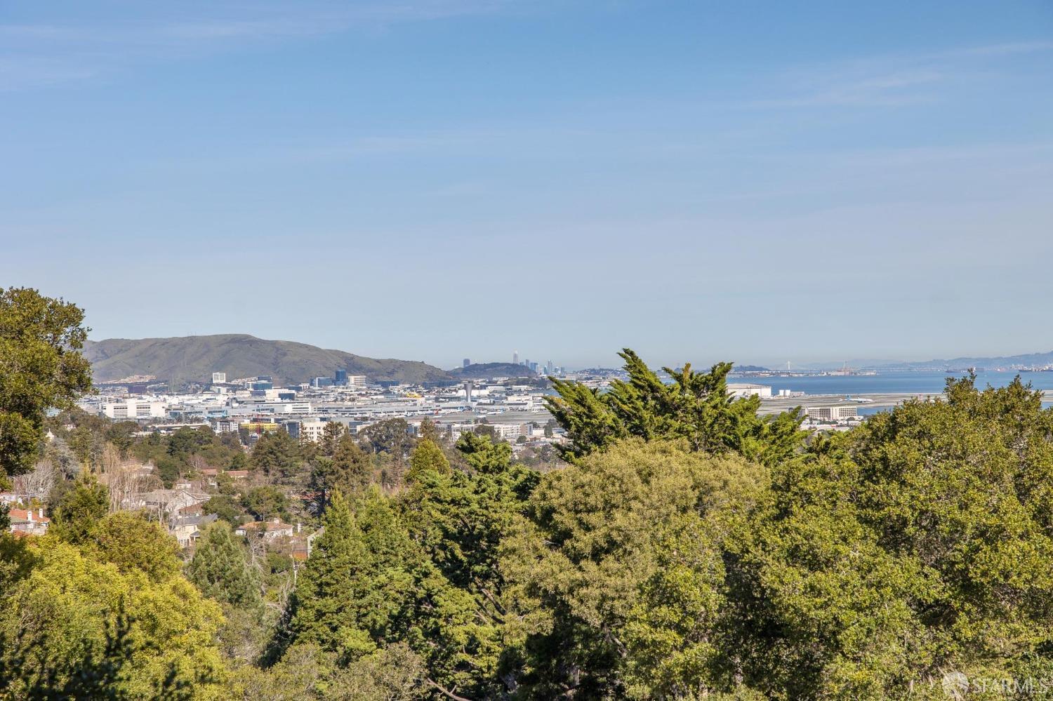2480 Summit Drive Hillsborough, CA 94010 - Photo 9 of 12 a view of a large building with a mountain in the background