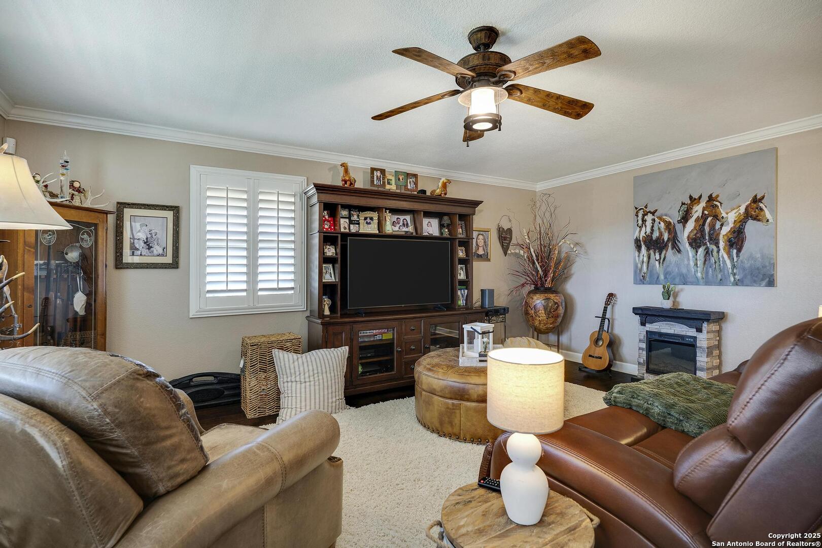 15090 Highway 46 Spring Branch, TX 78070 - Photo 15 of 71 a living room with furniture and a flat screen tv