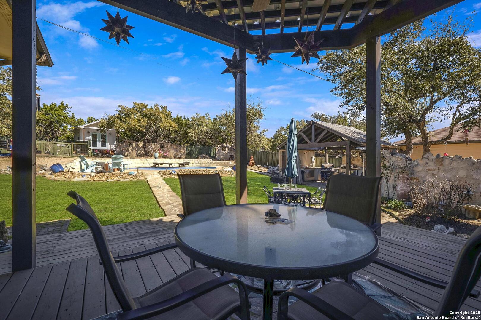 15090 Highway 46 Spring Branch, TX 78070 - Photo 18 of 71 a view of a chairs and table in the patio