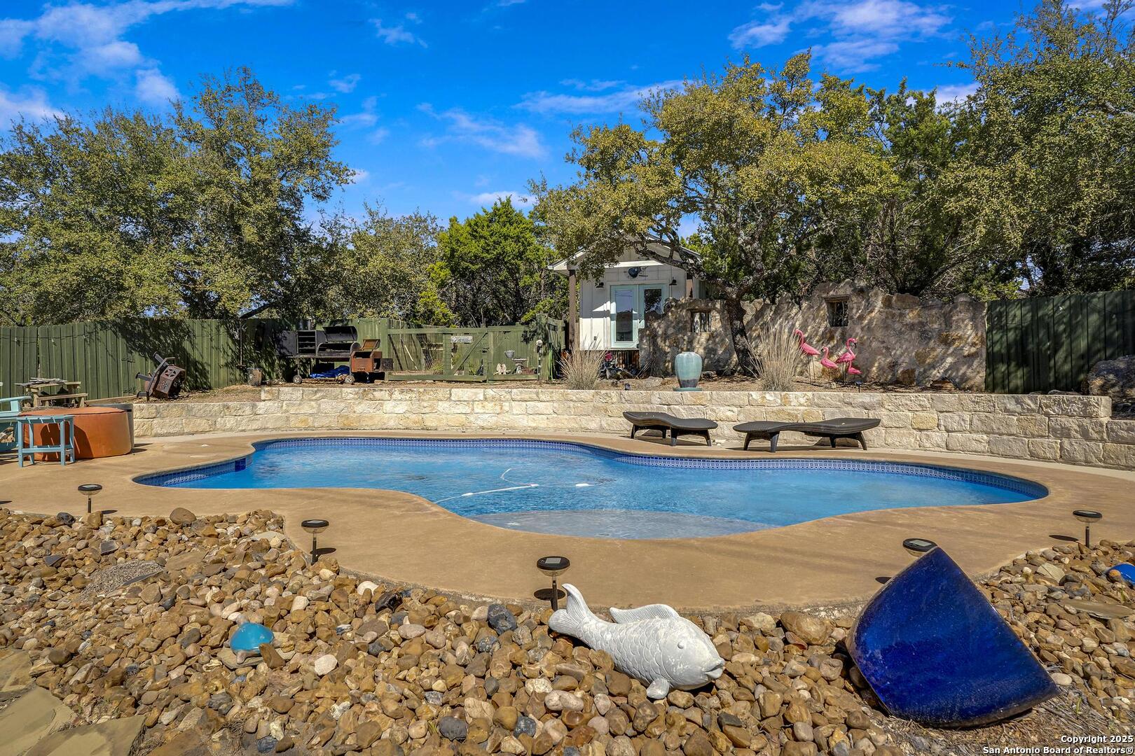 15090 Highway 46 Spring Branch, TX 78070 - Photo 21 of 71 a view of a swimming pool with an outdoor space
