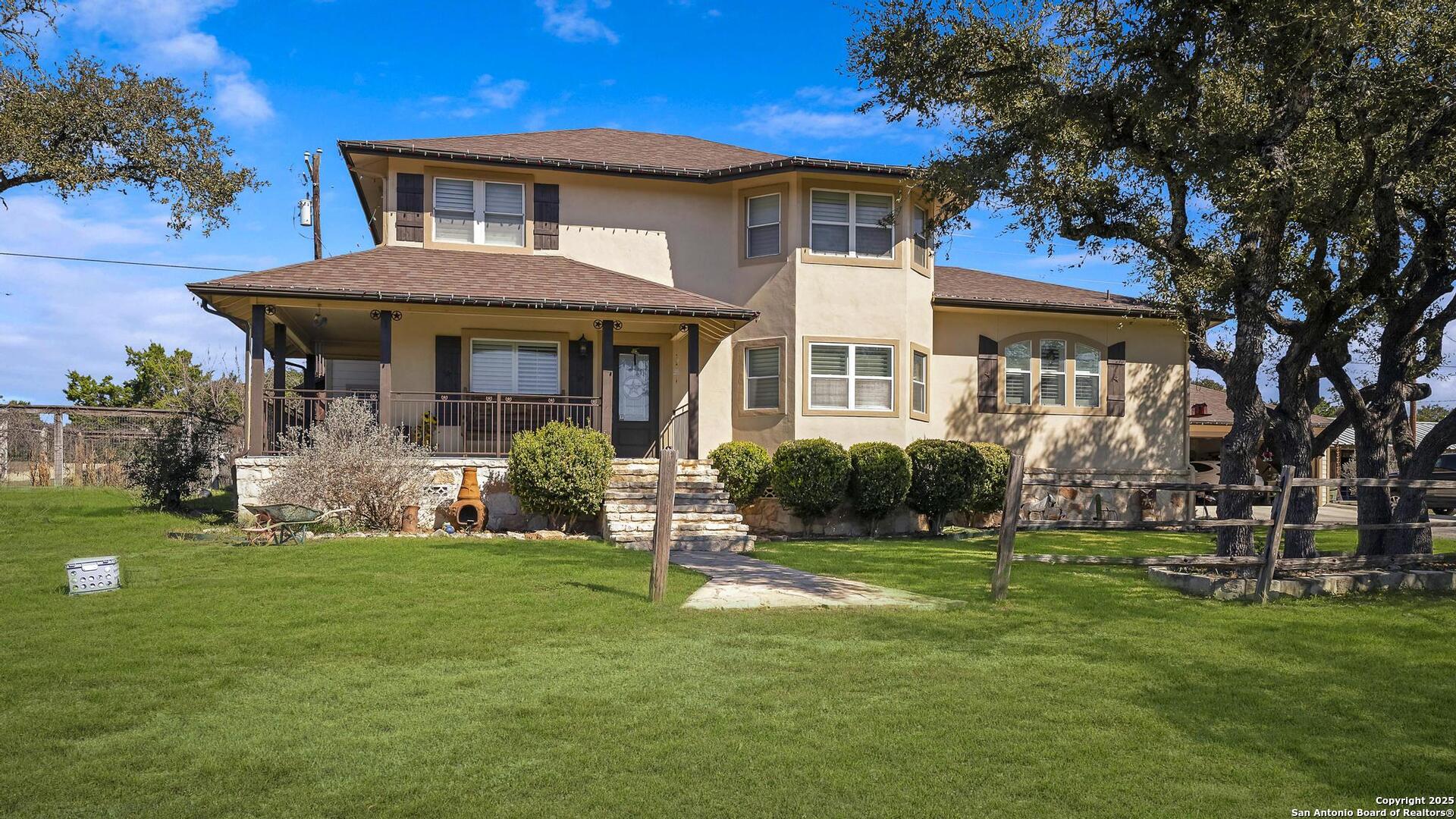 15090 Highway 46 Spring Branch, TX 78070 - Photo 3 of 71 a front view of a house with a yard