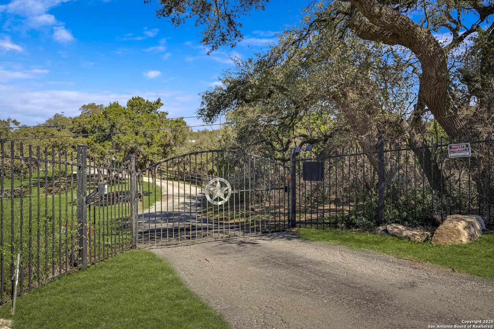 15090 Highway 46 Spring Branch, TX 78070 - Photo 32 of 71 a view of a park with iron fence