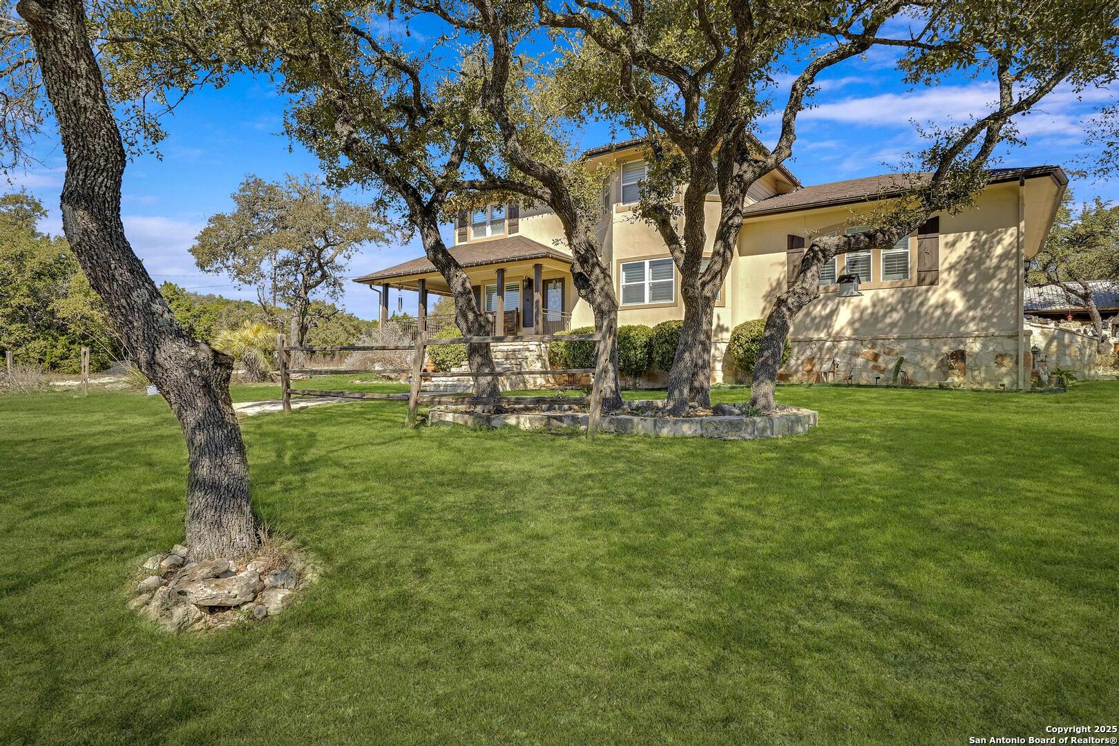 15090 Highway 46 Spring Branch, TX 78070 - Photo 5 of 71 a view of a house with a yard