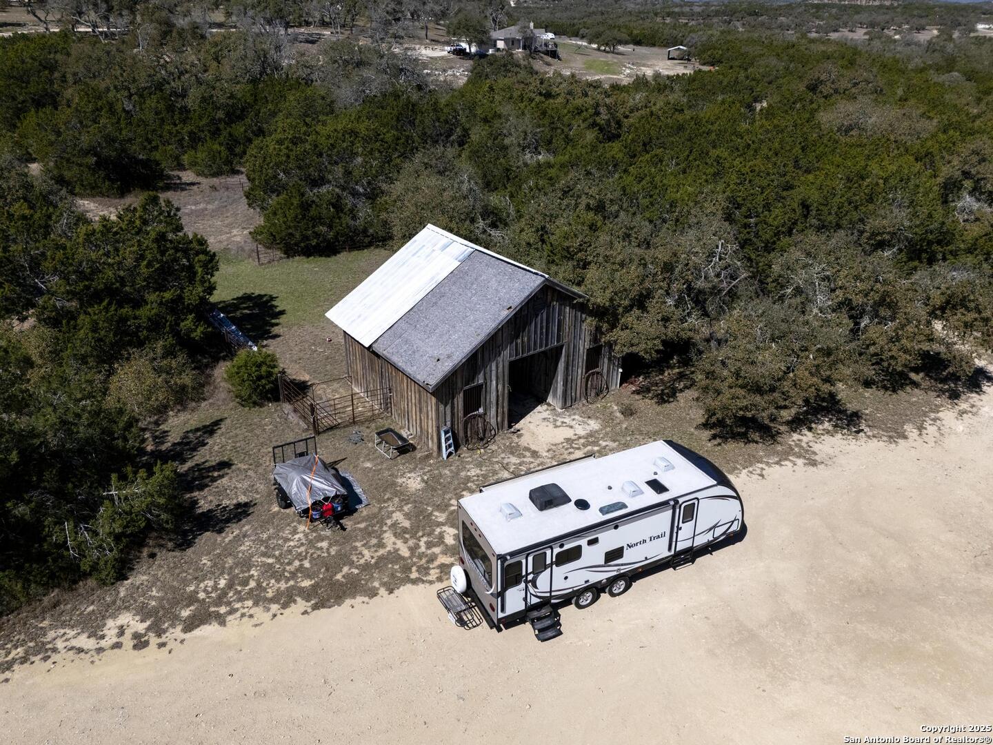 15090 Highway 46 Spring Branch, TX 78070 - Photo 54 of 71 an aerial view of a house with a yard and lake view