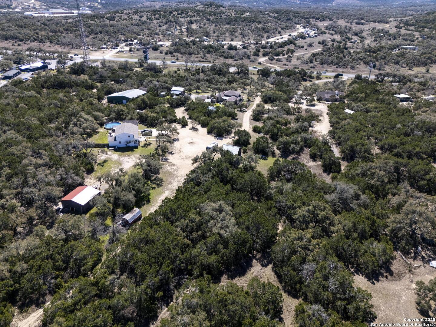 15090 Highway 46 Spring Branch, TX 78070 - Photo 57 of 71 an aerial view of residential houses with outdoor space and trees