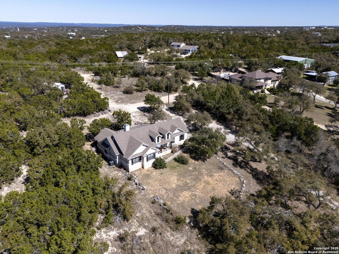 15090 Highway 46 Spring Branch, TX 78070 - Photo 67 of 71 an aerial view of residential house with parking and trees