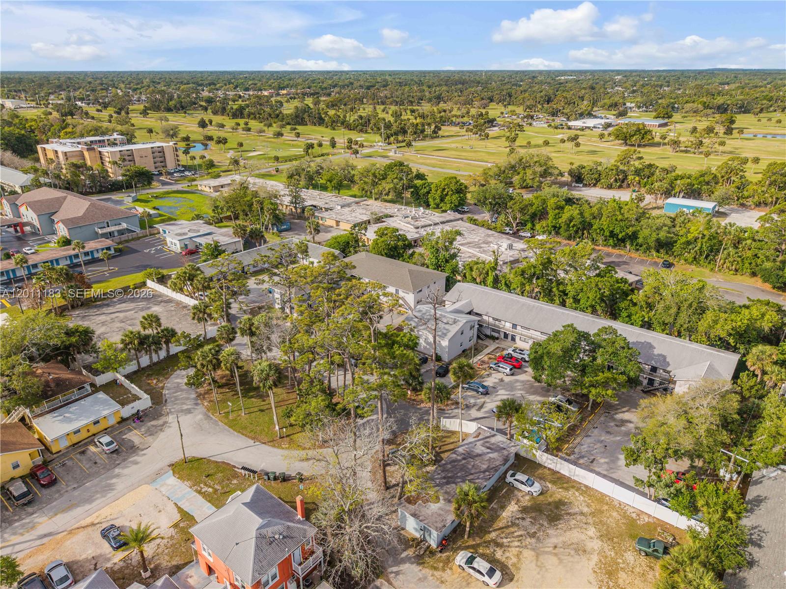 1208 South Ridgewood Avenue Daytona Beach, FL 32114 - Photo 20 of 27 an aerial view of residential houses with outdoor space