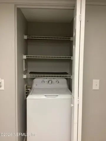 a utility room with dryer and washer