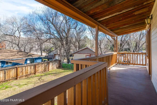 a view of a house with pool and wooden floor