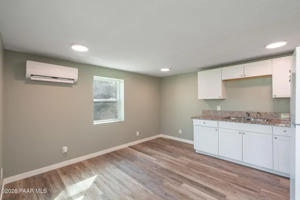 a bathroom with a sink a vanity and a mirror