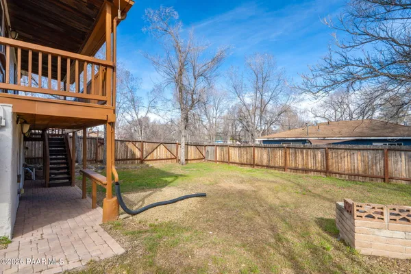 a view of backyard with small cabin