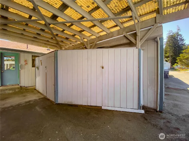 a view of a room with wooden walls