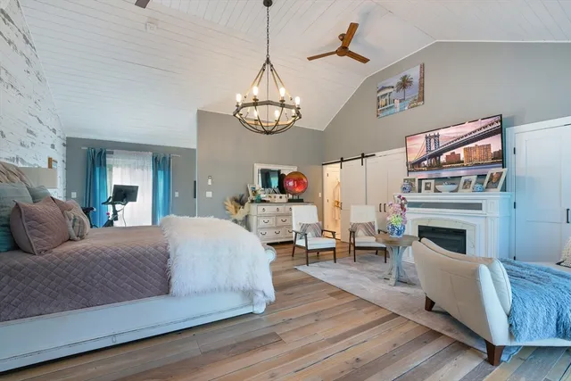 a living room with fireplace furniture and a chandelier