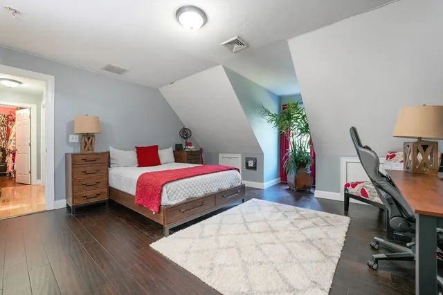 a bed room with a bed and a tv