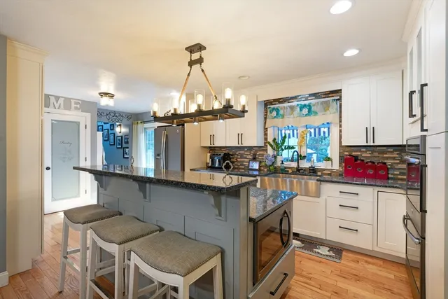 a kitchen with a sink cabinets and window