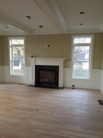 5 Duxbury Road Wellesley, MA 02481 - Photo 3 of 5 an empty room with windows and fireplace