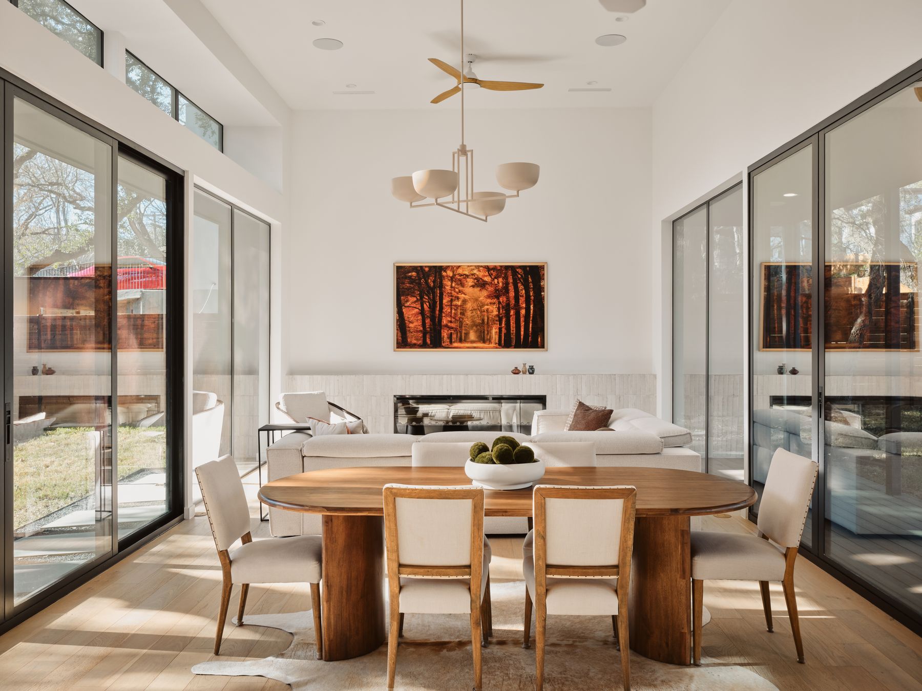 3209 Clawson Road Austin, TX 78704 - Photo 8 of 30 Dining area with wood finished floors, a high ceiling, a ceiling fan, and a wainscoted wall