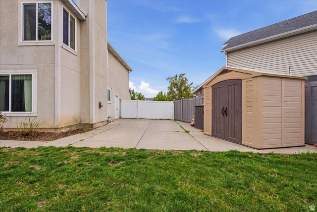 7975 Showcase Lane Sandy, UT 84094 - Photo 28 of 29 RV parking area behind a gate