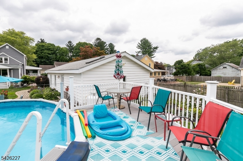 36 Main Street Flanders, NJ 07836 - Photo 41 of 49 a view of a chair and tables in the back yard of the house