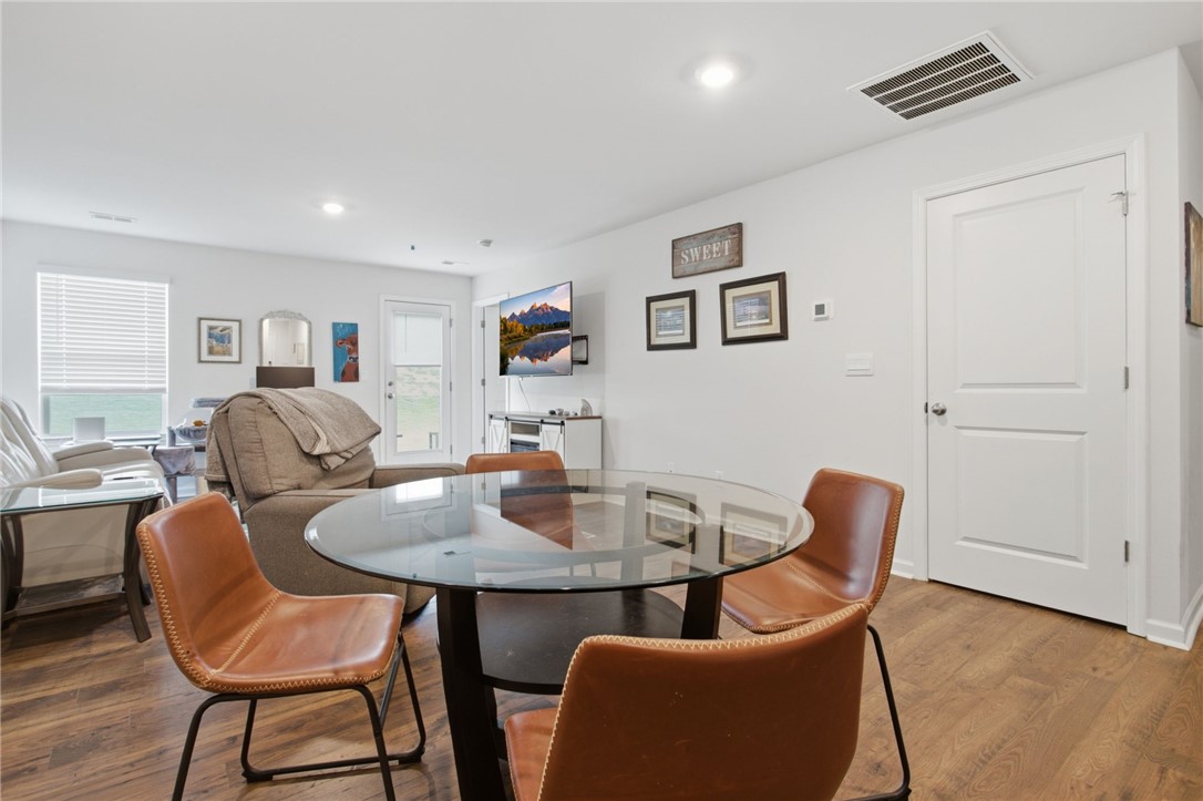 216 Boxbury Way Fountain Inn, SC 29644 - Photo 14 of 28 Warm wood flooring and recessed lighting define this inviting, open-concept interior space.