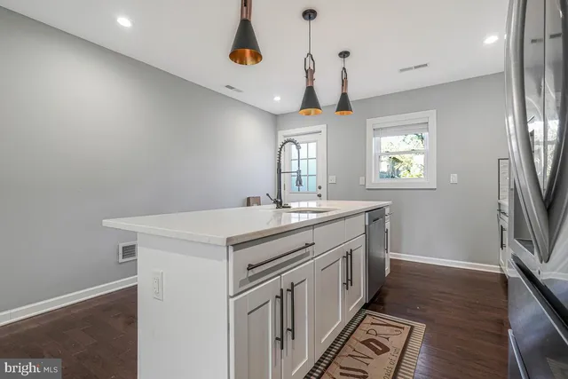 a kitchen that has a lot of countertop in it