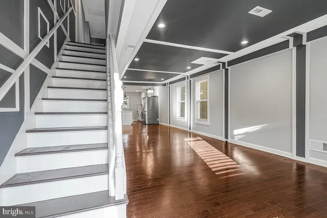 a view of entryway with wooden floor