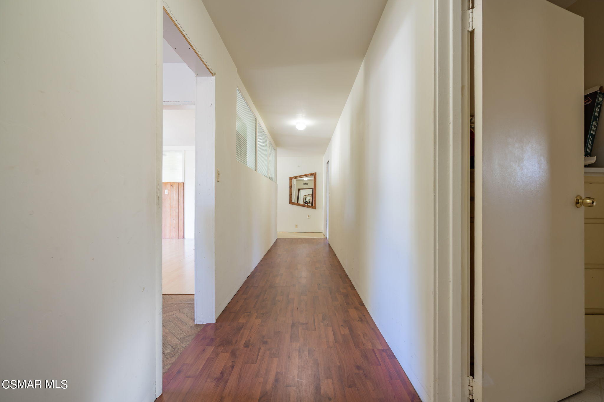 10901 Darling Road Ventura, CA 93004 - Photo 22 of 68 a view of a hallway with wooden floor
