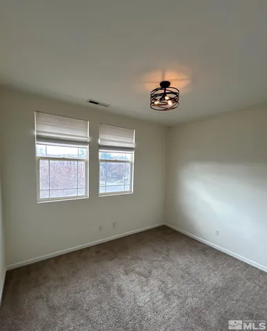 a bathroom with a sink a toilet a mirror and shower