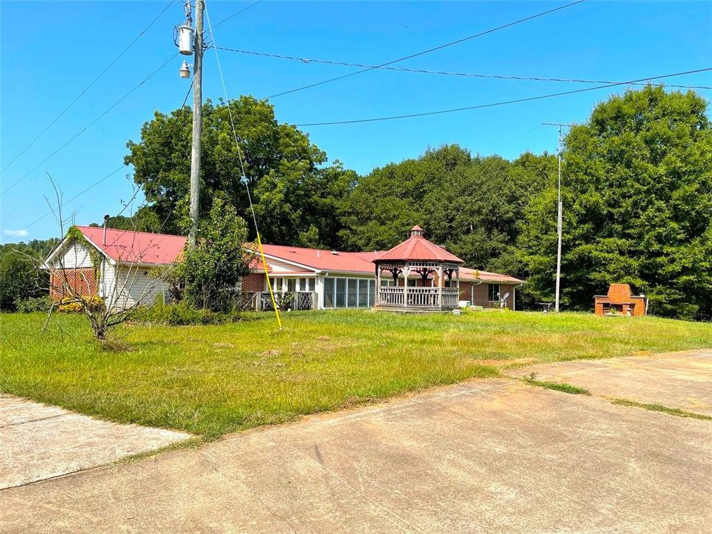 1134 Oak Grove Road Athens, GA 30607 - Photo 1 of 1 a front view of a house with a yard and trees