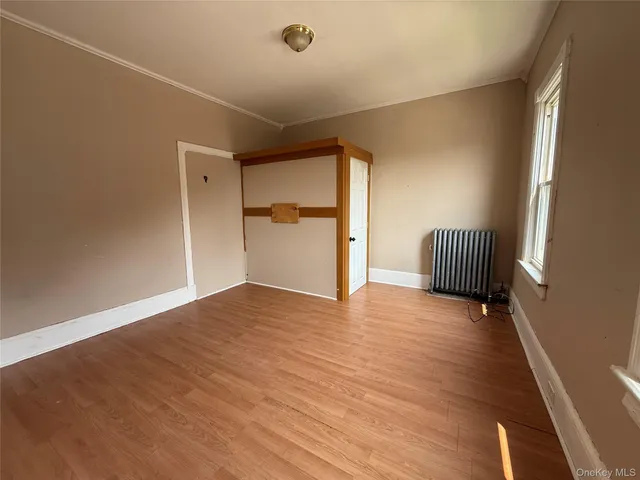a view of room with wooden floor and chair