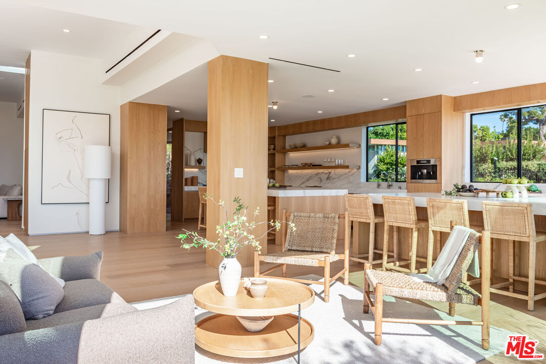 1705 Carla Ridge Beverly Hills, CA 90210 - Photo 13 of 53 a dining room with furniture and a large window