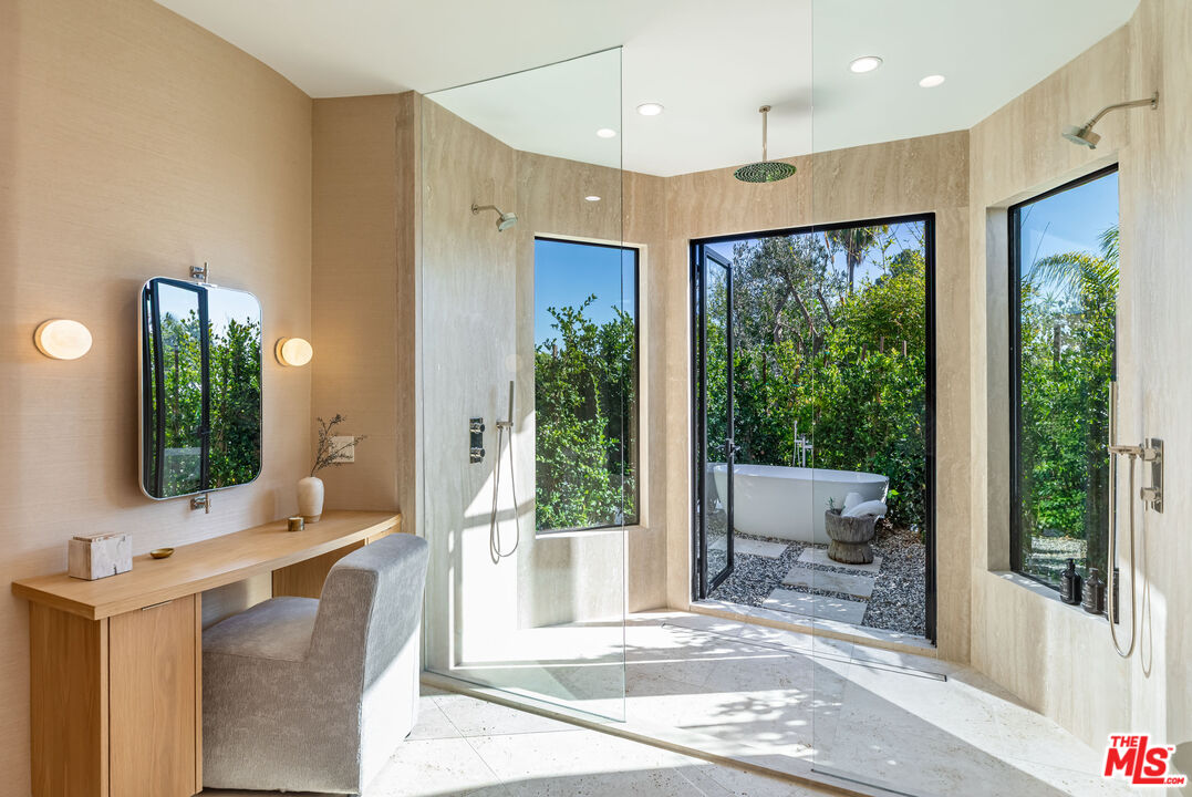 1705 Carla Ridge Beverly Hills, CA 90210 - Photo 20 of 53 a living room with large windows and furniture