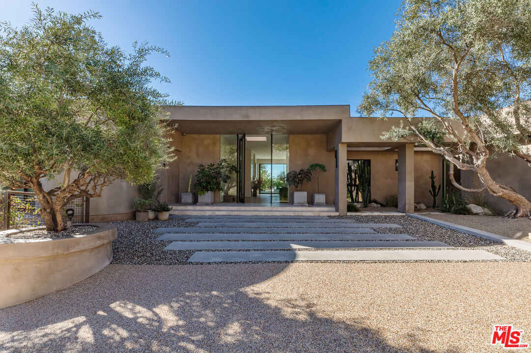 1705 Carla Ridge Beverly Hills, CA 90210 - Photo 2 of 53 a view of a house with garage