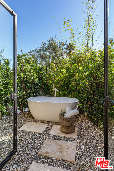 1705 Carla Ridge Beverly Hills, CA 90210 - Photo 21 of 53 a view of a bathtub in the garden