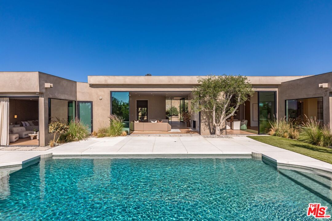 1705 Carla Ridge Beverly Hills, CA 90210 - Photo 35 of 53 a view of a house with backyard porch and sitting area