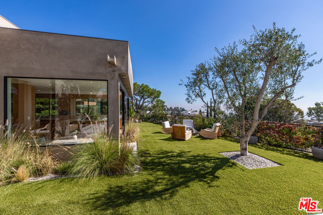 1705 Carla Ridge Beverly Hills, CA 90210 - Photo 37 of 53 a view of a house with swimming pool yard and outdoor seating