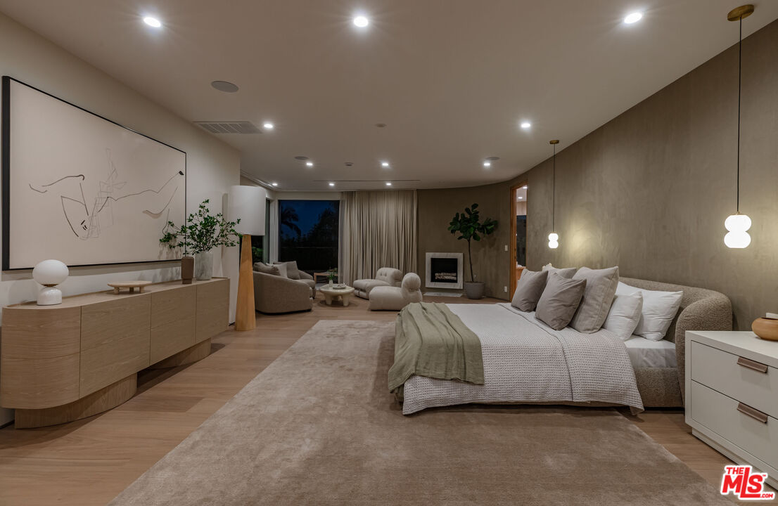 1705 Carla Ridge Beverly Hills, CA 90210 - Photo 48 of 53 a living room with furniture and a large window