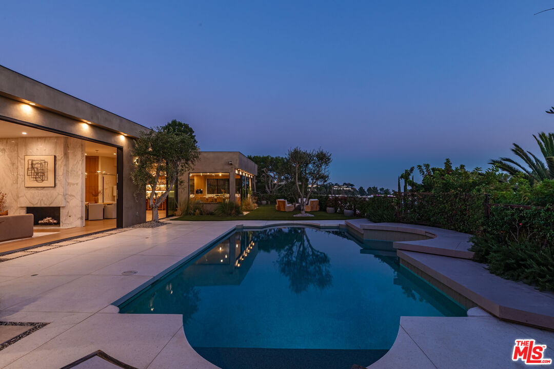 1705 Carla Ridge Beverly Hills, CA 90210 - Photo 50 of 53 a swimming pool with outdoor seating and yard