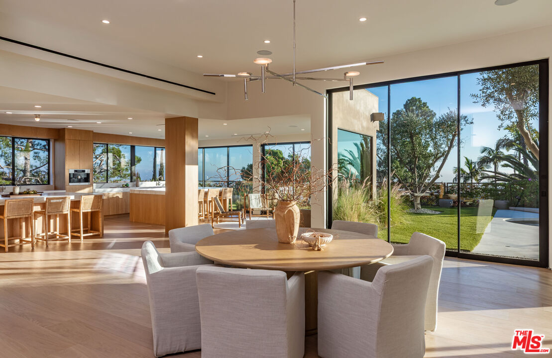 1705 Carla Ridge Beverly Hills, CA 90210 - Photo 8 of 53 a view of a dining room with furniture window and outside view