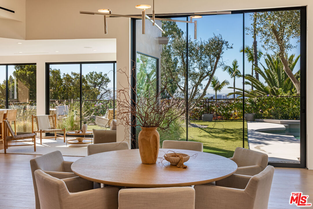 1705 Carla Ridge Beverly Hills, CA 90210 - Photo 9 of 53 a view of a dining room with furniture window and outside view