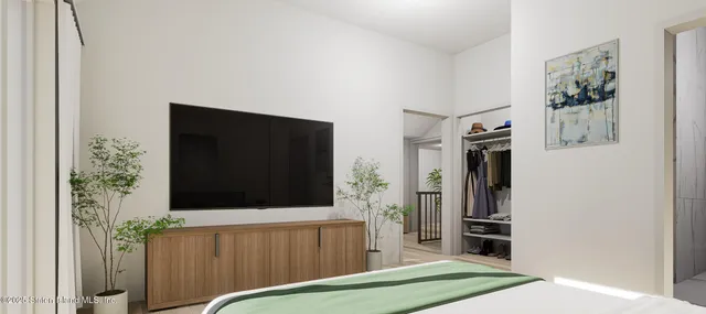 a living room with a large window and a couch