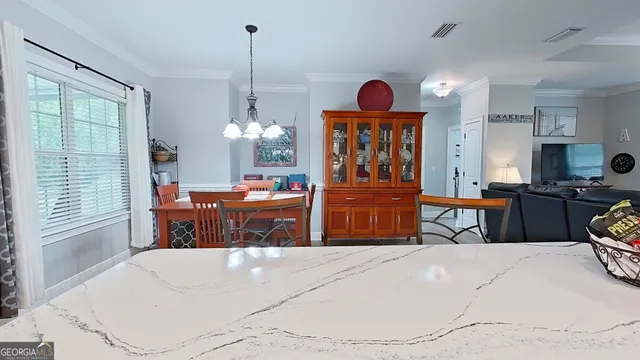 a bed room with furniture and a chandelier