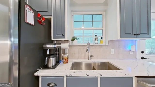 a kitchen with a sink and a window