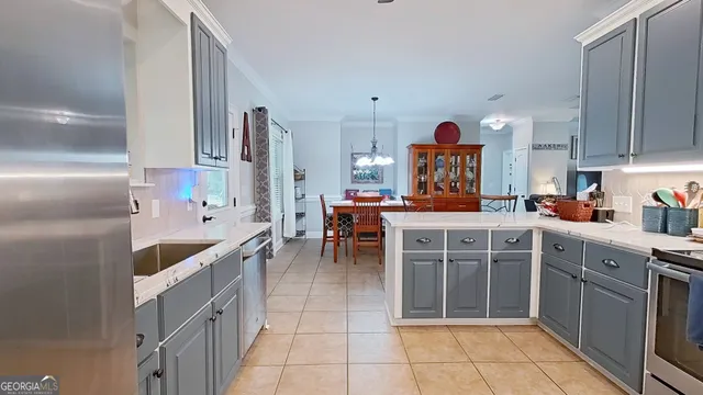 a kitchen with cabinets and window