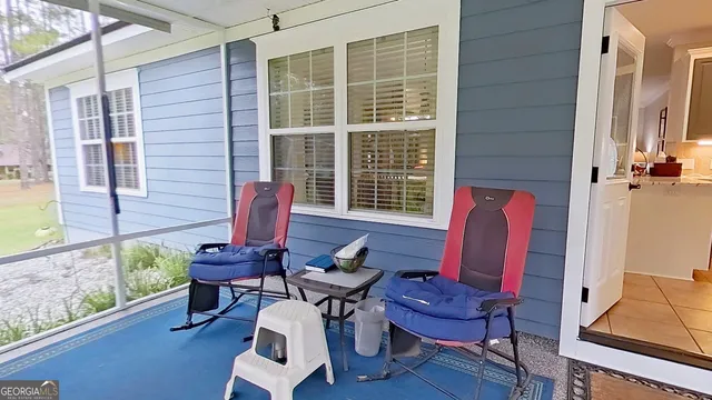 a view of a livingroom with lounge chairs