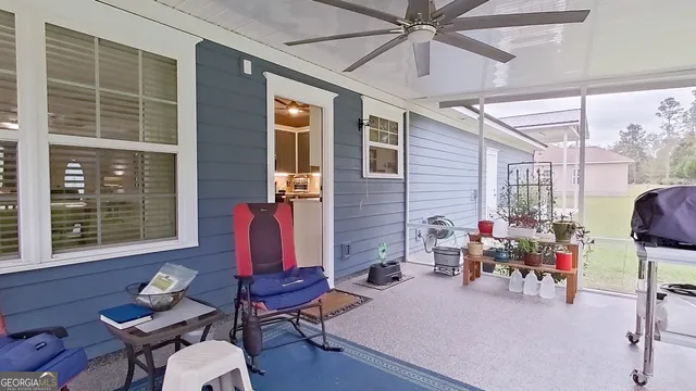 a room with furniture and a large window