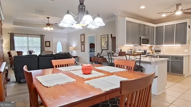 a dining room with a table or chairs and a dining table with kitchen view