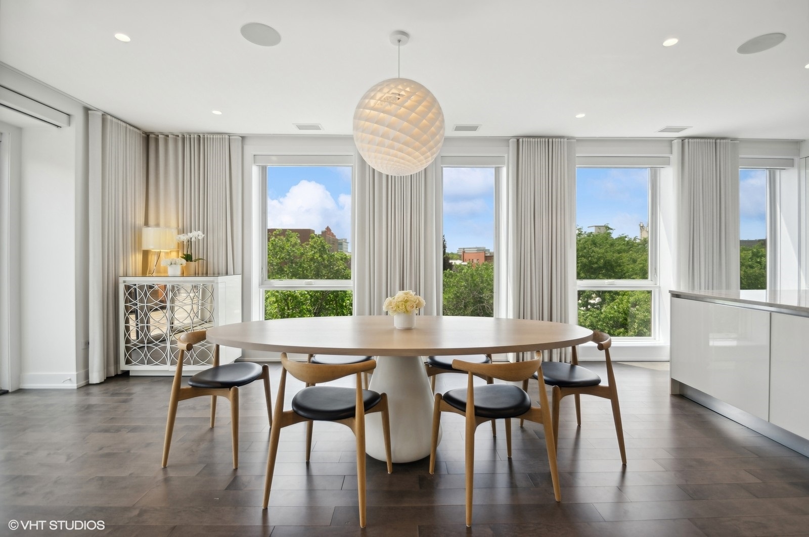 1625 North Burling Street, Unit 401 Chicago, IL 60614 - Photo 11 of 42 a view of a dining room with furniture window and wooden floor